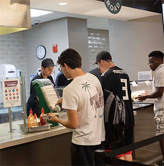 Students at a customer counter